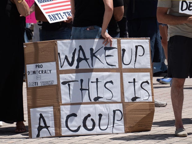 Protesters rally in Miami against Trump administration ahead of 100th day in office 