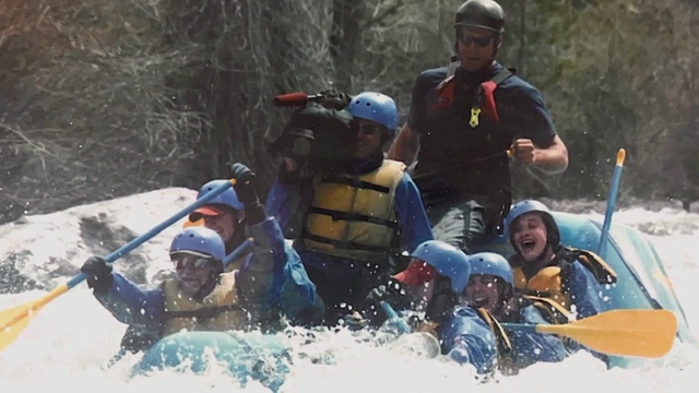 john-mason-with-camera-while-rafting.png 