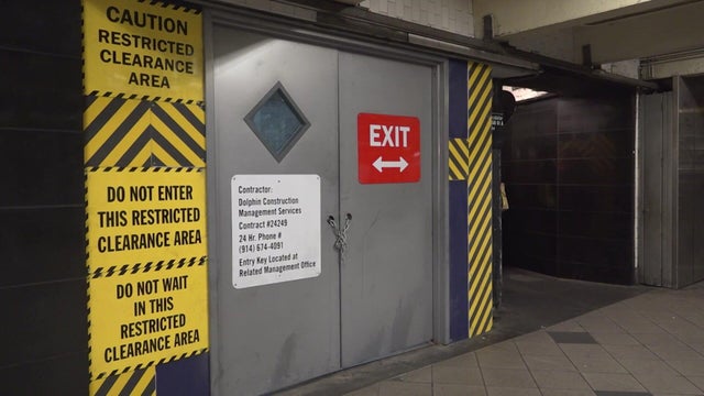 Escalators are blocked off by temporary doors and walls. 