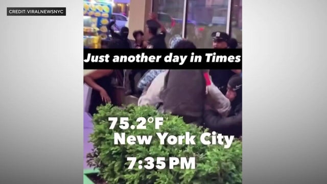 Teenagers attacking two NYPD officers in Times Square. 