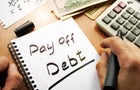Note with words pay off debt concept. 