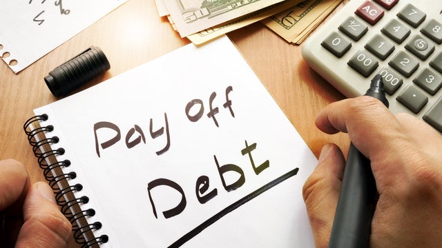 Note with words pay off debt concept. 