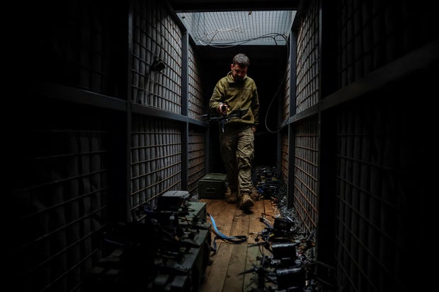 Ukrainian service members prepare FPV drones during the unilaterally proposed three-day ceasefire declared by Russia, near a frontline in Dnipropetrovsk region