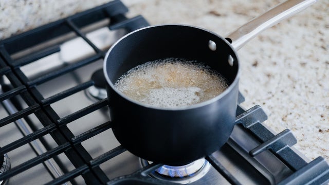 Food Boils in Pot on Gas Cooktop 
