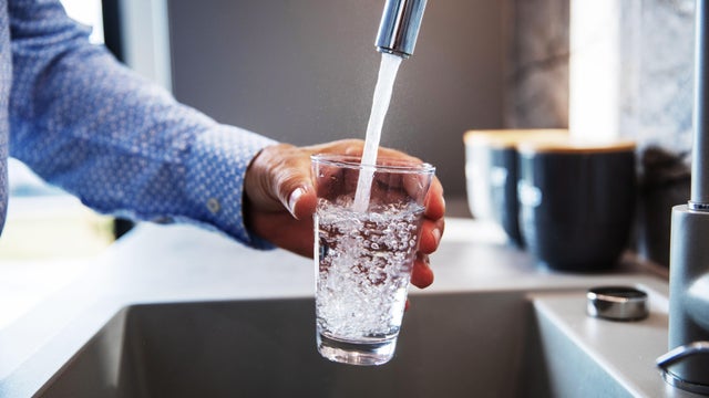Man Pouring Himself Water 
