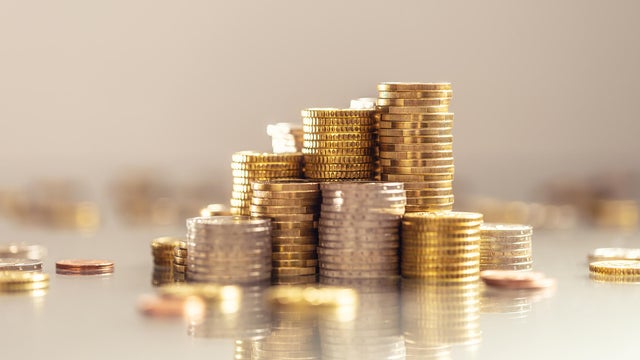 Towers made out of gold and silver Euro coins. 