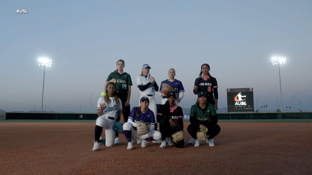 Girl Getting a Hit  Playing Youth  Softball League Game 