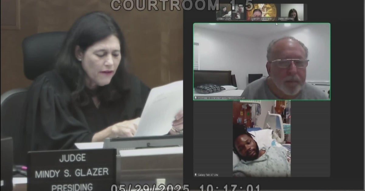 Driver shot by police after Miami officer lands on hood appears in bond court from ICU