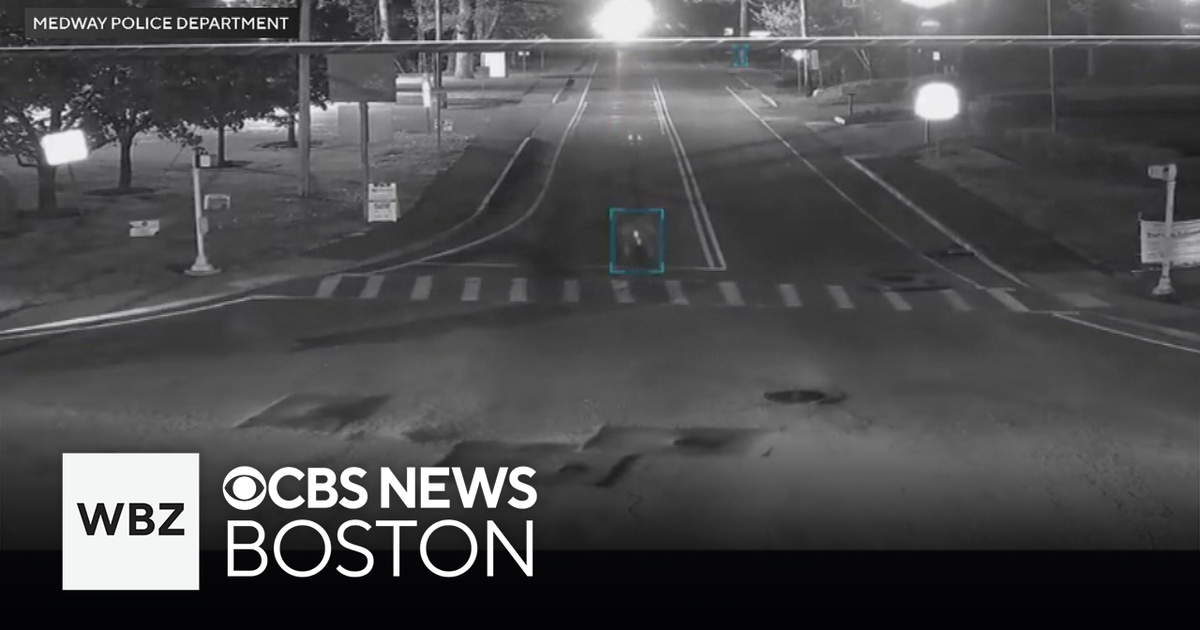 Medway police release video of close call between e-bike, car - CBS Boston