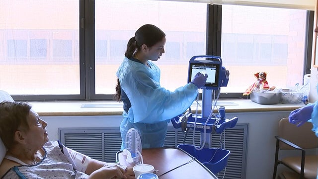 A student in the workforce program works with a patient at Jefferson Health 