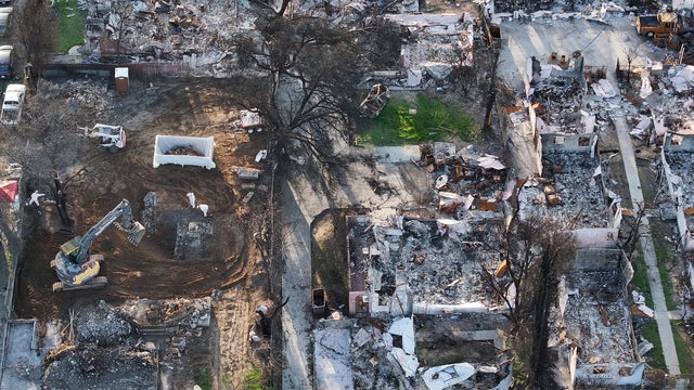 Los Angeles Communities Face Long Road To Recovery After Devastating Wildfires 