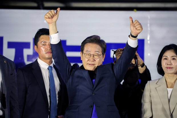 Lee Jae-myung, the presidential candidate for South Korea's Democratic Party, gestures as he greets his supporters in front of the National Assembly in Seoul, South Korea, June 4, 2025.