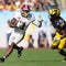 Judge approves NCAA settlement, clearing way for schools to pay athletes