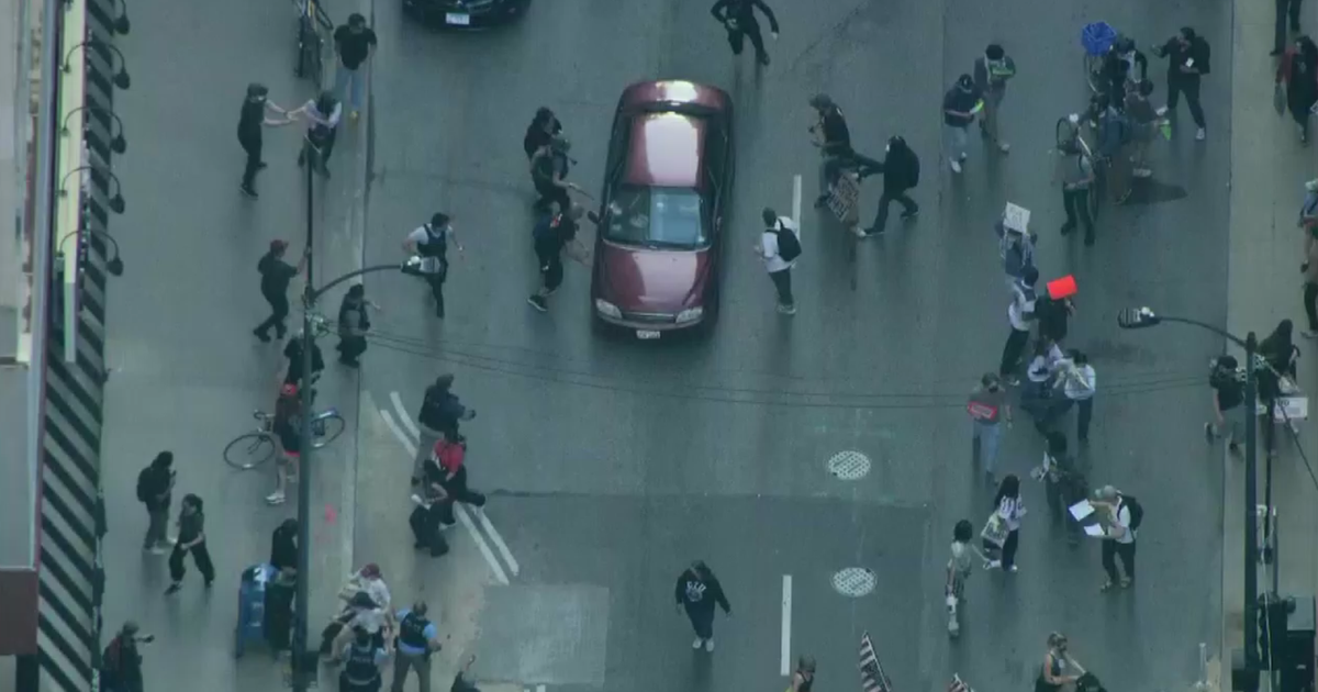 ICE protest draws thousands to Loop; car plows through early on 