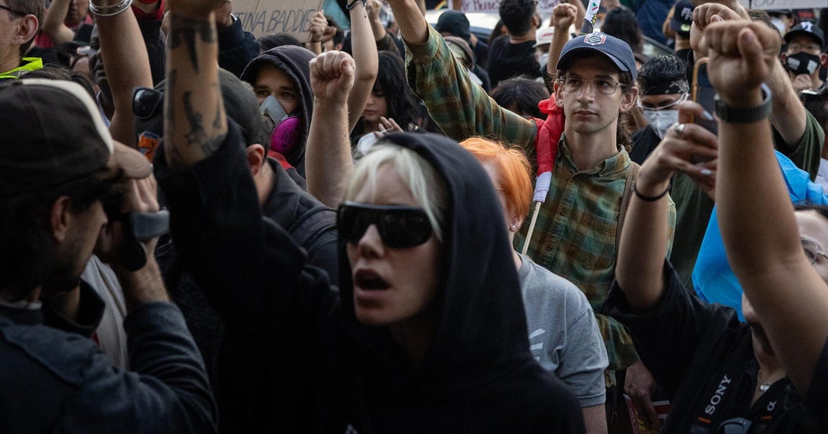 Protests against immigration raids spread across U.S.