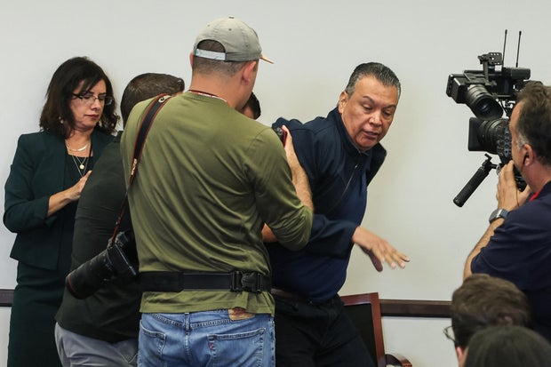 Sen. Alex Padilla, Democrat from California, is removed from the room after interrupting a news conference with Department of Homeland Security Secretary Kristi Noem at the Wilshire Federal Building in Los Angeles on June 12, 2025.  