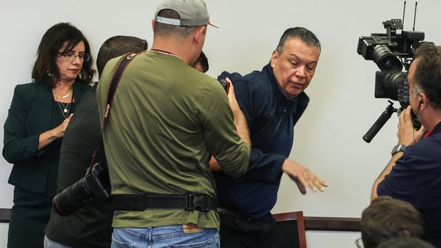 Sen. Alex Padilla, Democrat from California, is removed from the room after interrupting a news conference with Department of Homeland Security Secretary Kristi Noem at the Wilshire Federal Building in Los Angeles on June 12, 2025. 