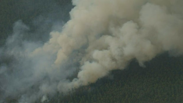 Mines Spung Wildfire Grows, Triggers Evacuations