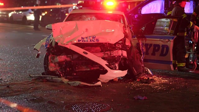 An NYPD vehicle with severe front-end damage 