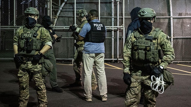 ICE agents stand outside Delaney Hall, a migrant detention facility, during a protest in Newark, New Jersey, on June 12, 2025. 