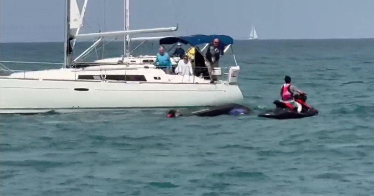 Boater urges safety after rescuing father, sons on capsized jet ski in Lake Michigan 