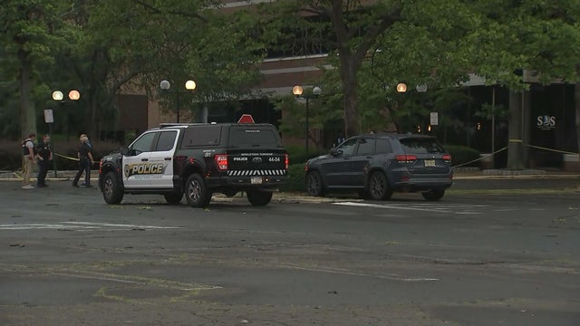 Generic police lights and yellow police tape at crime scene 