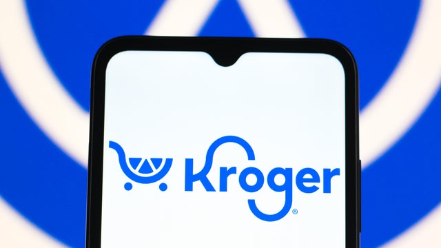 In this photo illustration, the Kroger logo is seen 