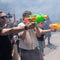 Some Spanish residents, armed with water guns, want tourists to go home
