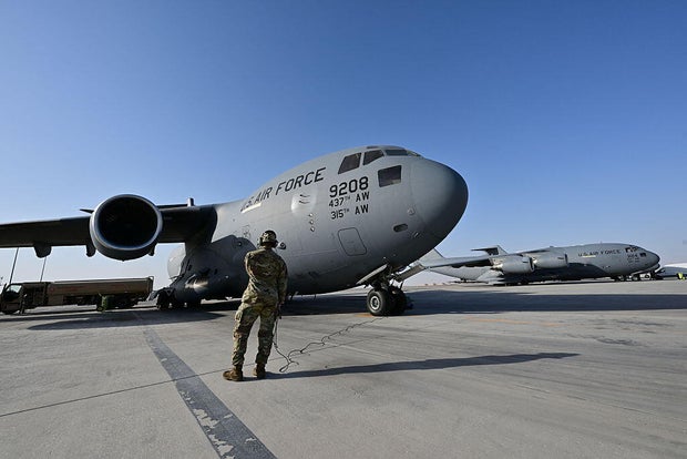 A U.S. military transport aircraft is pictured on the tarmac at the Al Udeid Air Base 