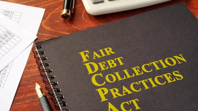 FDCPA Fair Debt Collection Practices Act on a table. 