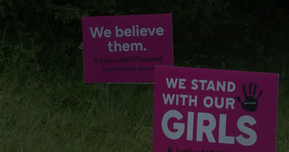 Maryland parents post pink signs to protest teacher's sexual abuse not guilty verdict 