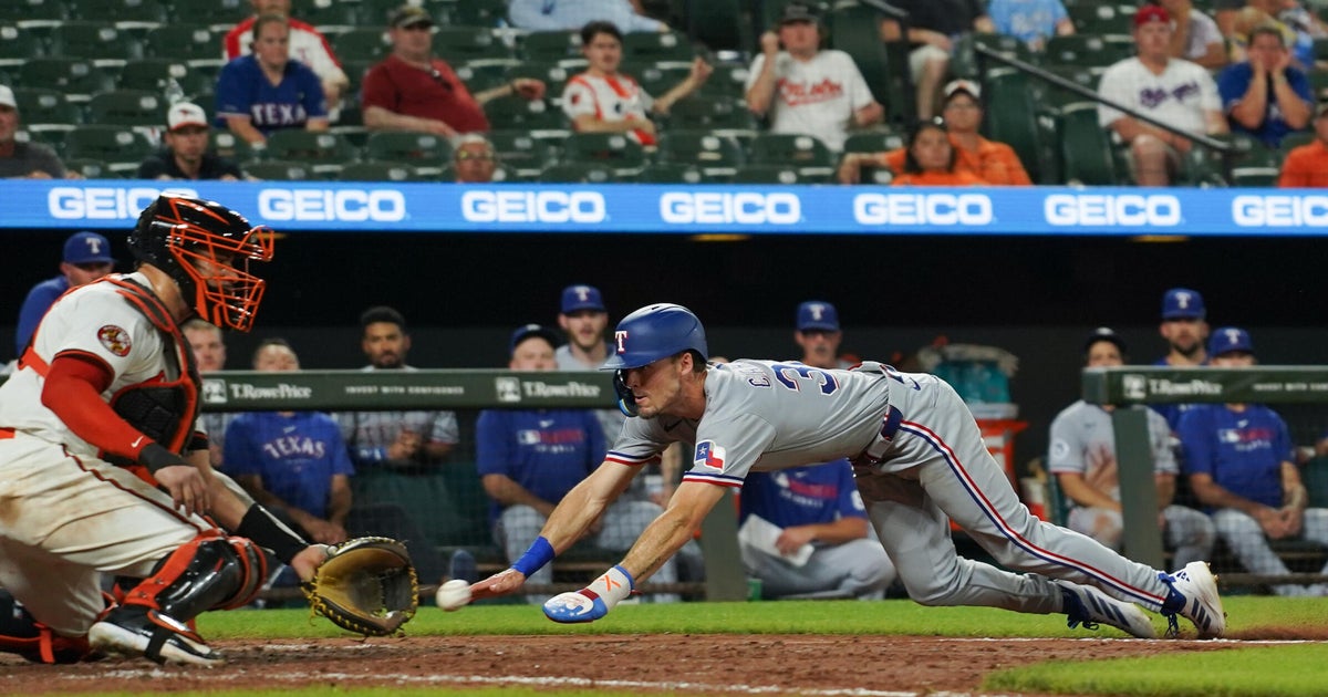 Evan Carter's slide home lifts Rangers over Orioles in 10th 