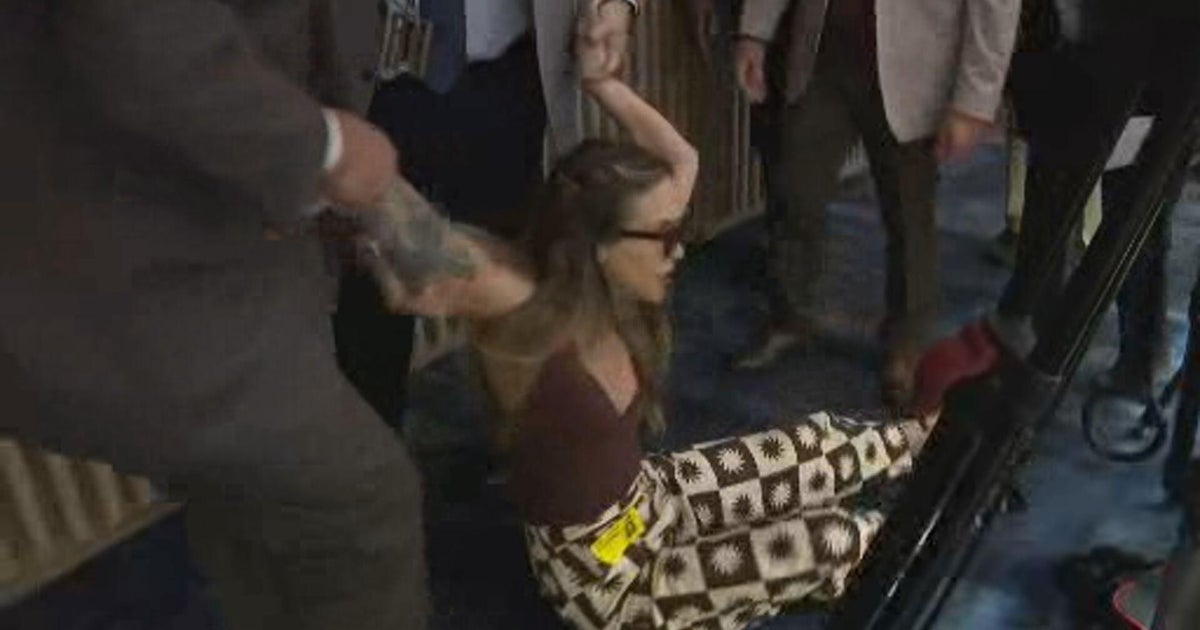 Video shows woman dragged out of Miami-Dade commission meeting after objecting to ICE agreement