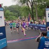 Runners cross the finish line of the NYRR Pride Run. 