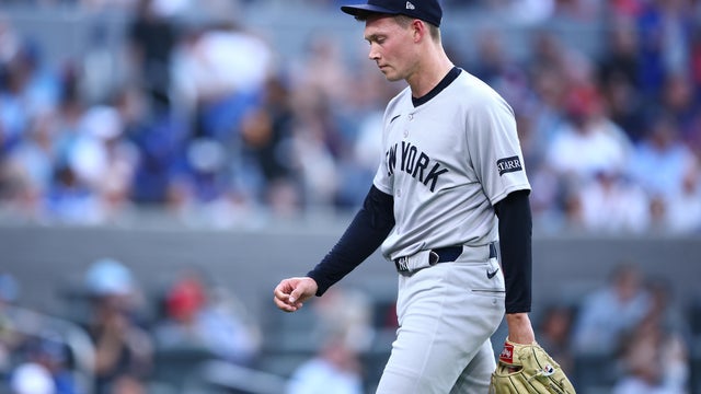 Will Warren #98 of the New York Yankees leaves the field at the end of the first inning after giving up 7 runs during a game against the Toronto Blue Jays at Rogers Centre on July 02, 2025 in Toronto, Ontario, Canada. 