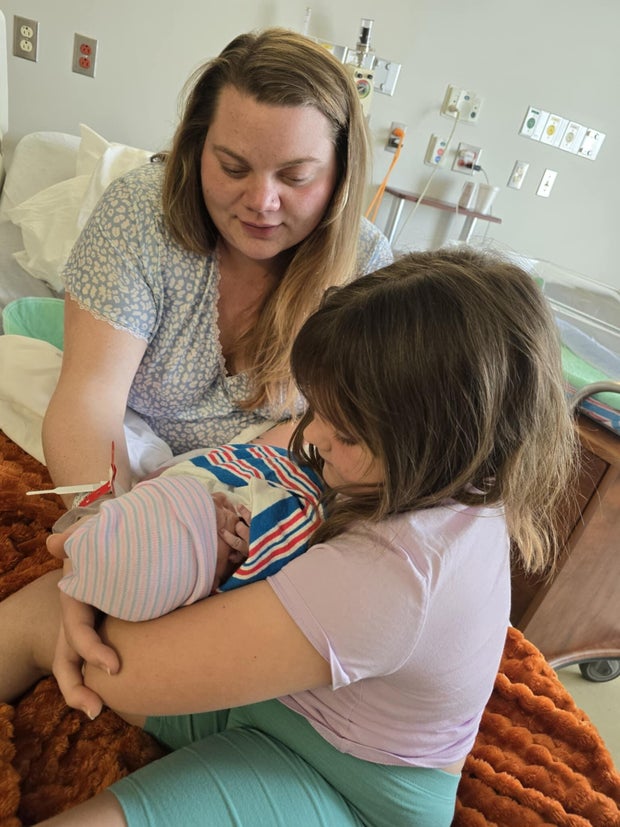 Katie and her two kids in the hospital. 