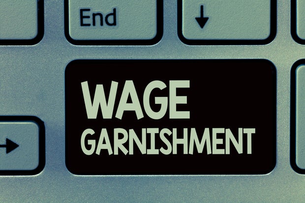 Handwriting substance penning Wage Garnishment. Concept meaning Deducting wealth from compensation ordered by the tribunal