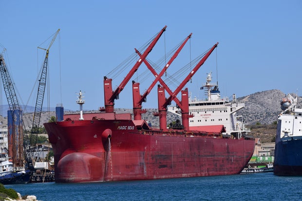The Magic Seas cargo ship docked at a port in Ampelakia, Salamis Island