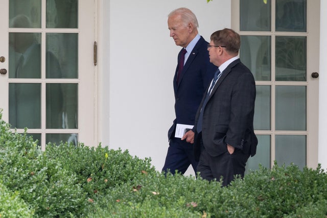 Former President Joe Biden speaks with White House Physician Kevin O'Connor as he arrives back at the White House in Washington, D.C., on Aug. 28, 2023. 