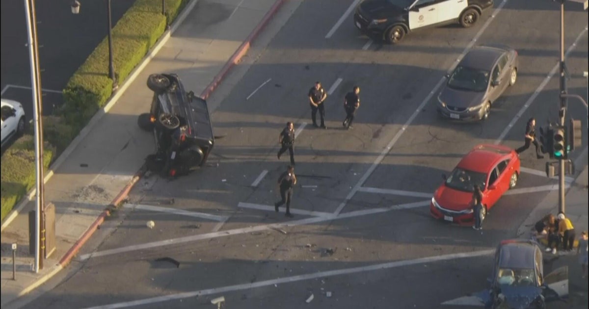 Stolen SUV ignites, LAPD officer crashes into building during pursuit 
