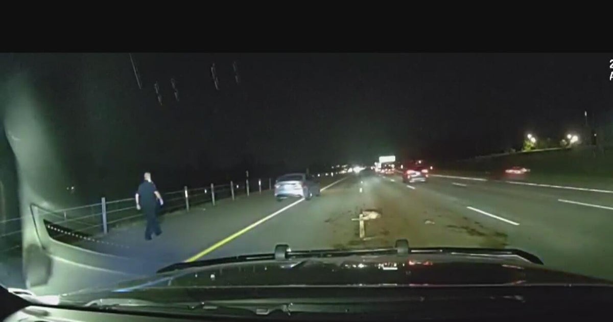 Video shows Livonia police officer nearly hitting by driver on road 