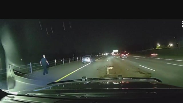 Video shows Livonia police officer nearly hitting by driver on road 