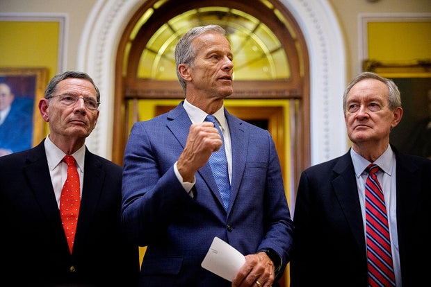 Senate Majority Leader John Thune, accompanied by Sen. John Barrasso and Sen. Mike Crapo, speaks to reporters at the U.S. Capitol on July 1, 2025, in Washington, DC. 