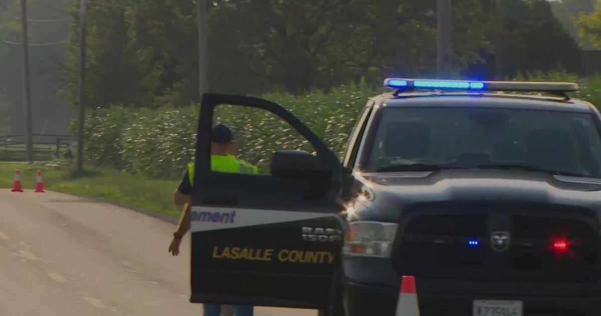 Suspect at large after 2 found dead in house fire in Sheridan, Illinois 