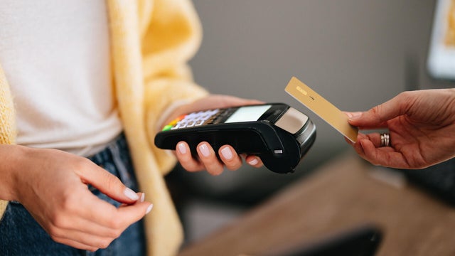 Close Up Photo Of Woman Hands Paying With Credit Card In A Home Decor Store 