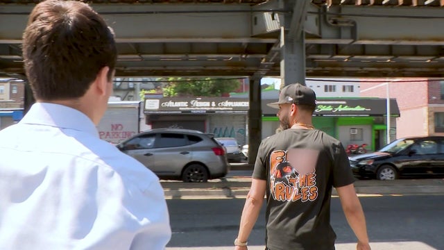 State to State Automotive manager Steven Ventura walks away from CBS News New York's Tim McNicholas. The back of his shirt reads, "F--- the rules." 