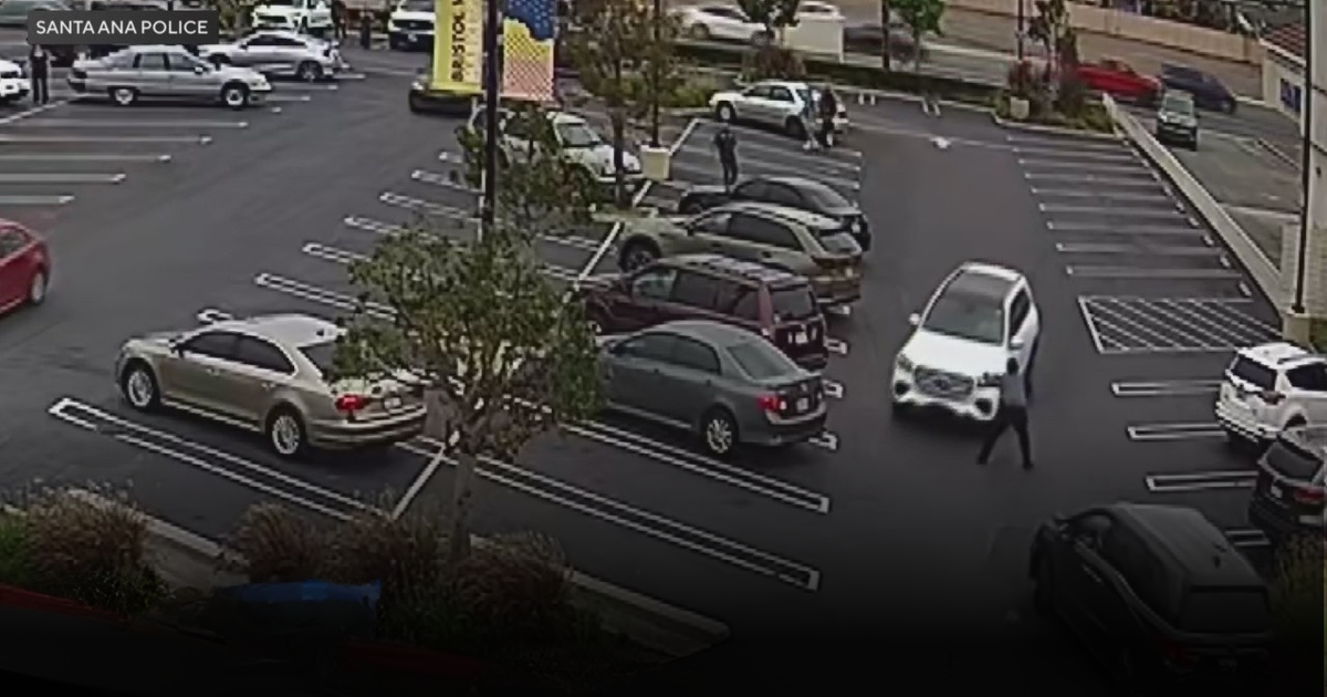 Getaway driver runs over security guard after robbery in Santa Ana parking lot 
