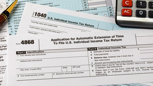Form 4868 automatic filing extension for federal income taxes. Income tax return filing deadline, delay and penalty concept. 