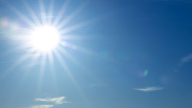 Full bright sun in the blue sky 