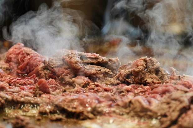 Beef slices for cheesesteaks are being fried at Jim's South St. in Philadelphia 